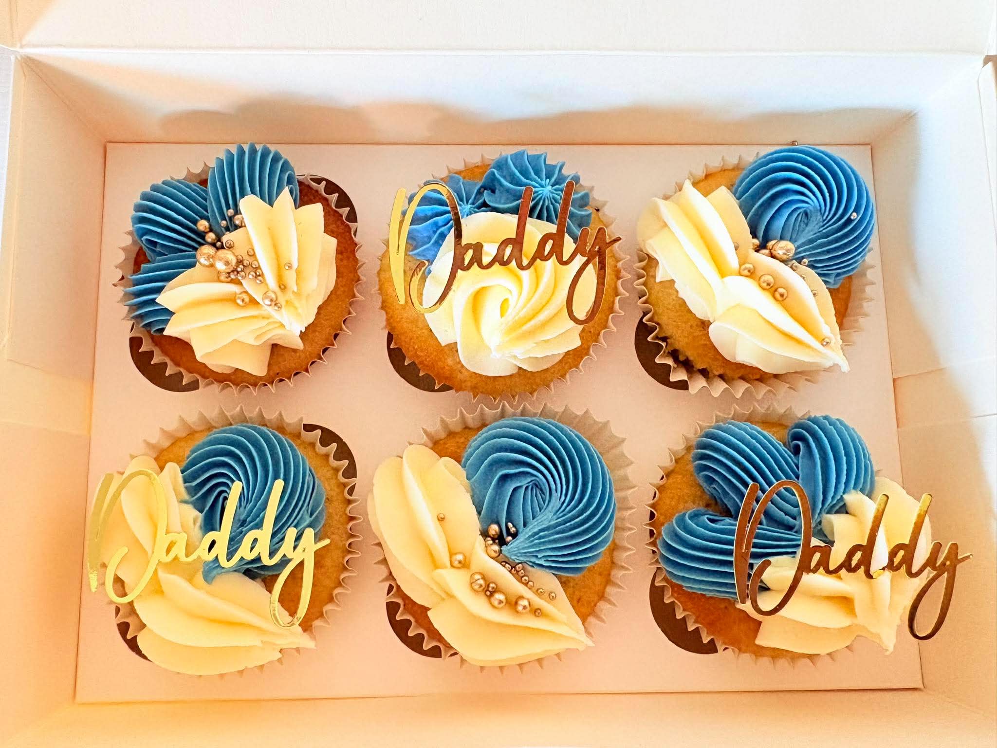 Blue, ivory and gold buttercream birthday cupcakes