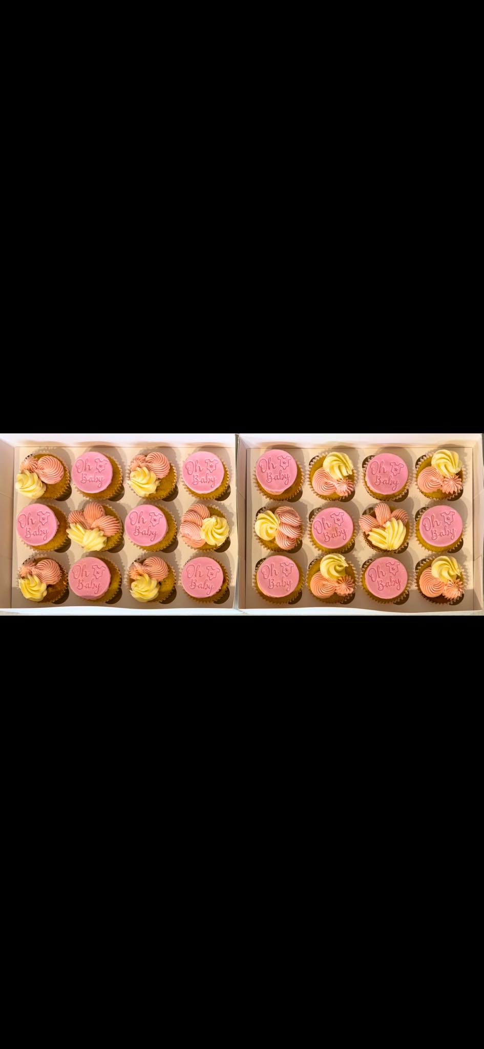 Pink and ivory baby shower cupcakes in two boxes
